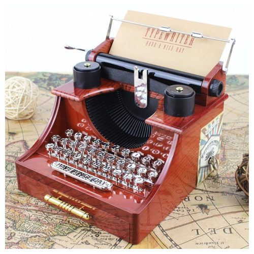 mini zenélő írógép